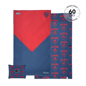 Red and navy AFL Melbourne Demons beach towel with geometric design and matching small cushion pillow, sand-free fabric