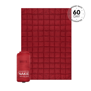 Studio shot of Nakie's Earth Red Sustainable Down Puffy blanket, showcasing its cozy warmth and eco-friendly design, perfect for outdoor adventures and cozy nights.